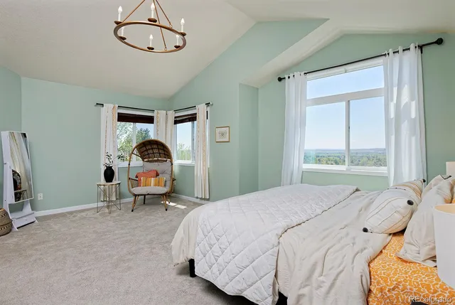 a bedroom with a bed and a mirror