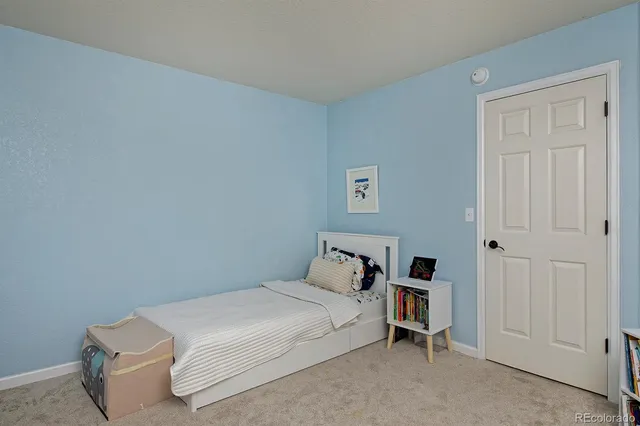 a bedroom with a bed and a cabinets