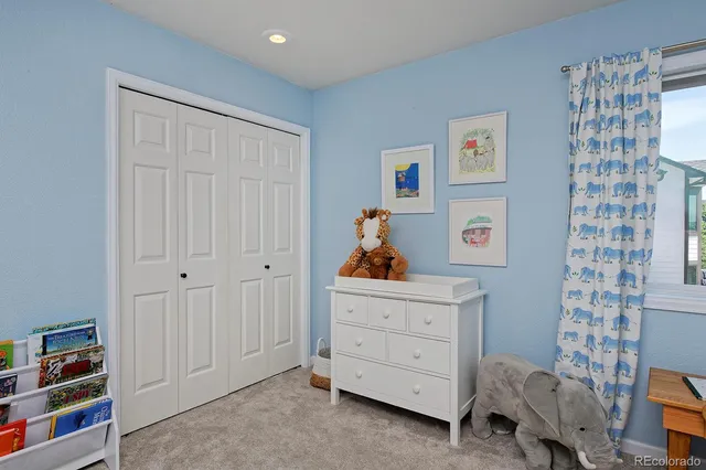 a bed room with a bed and a dresser