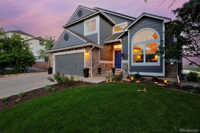 a front view of house with a garden