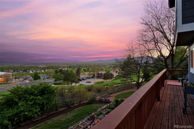 a view of a city from a balcony with outdoor space