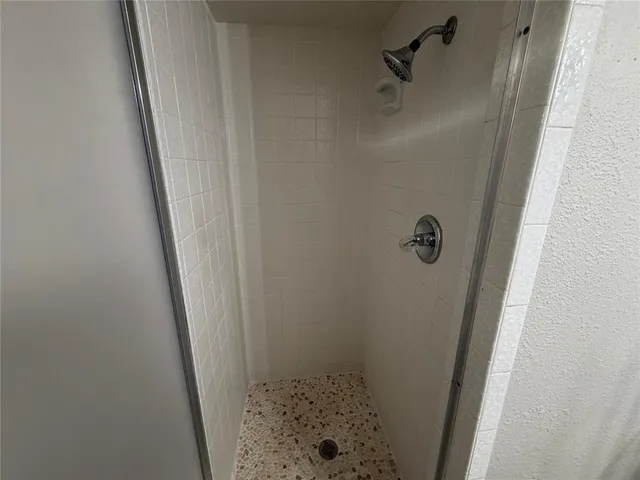 a bathroom with a granite countertop sink a toilet and a mirror