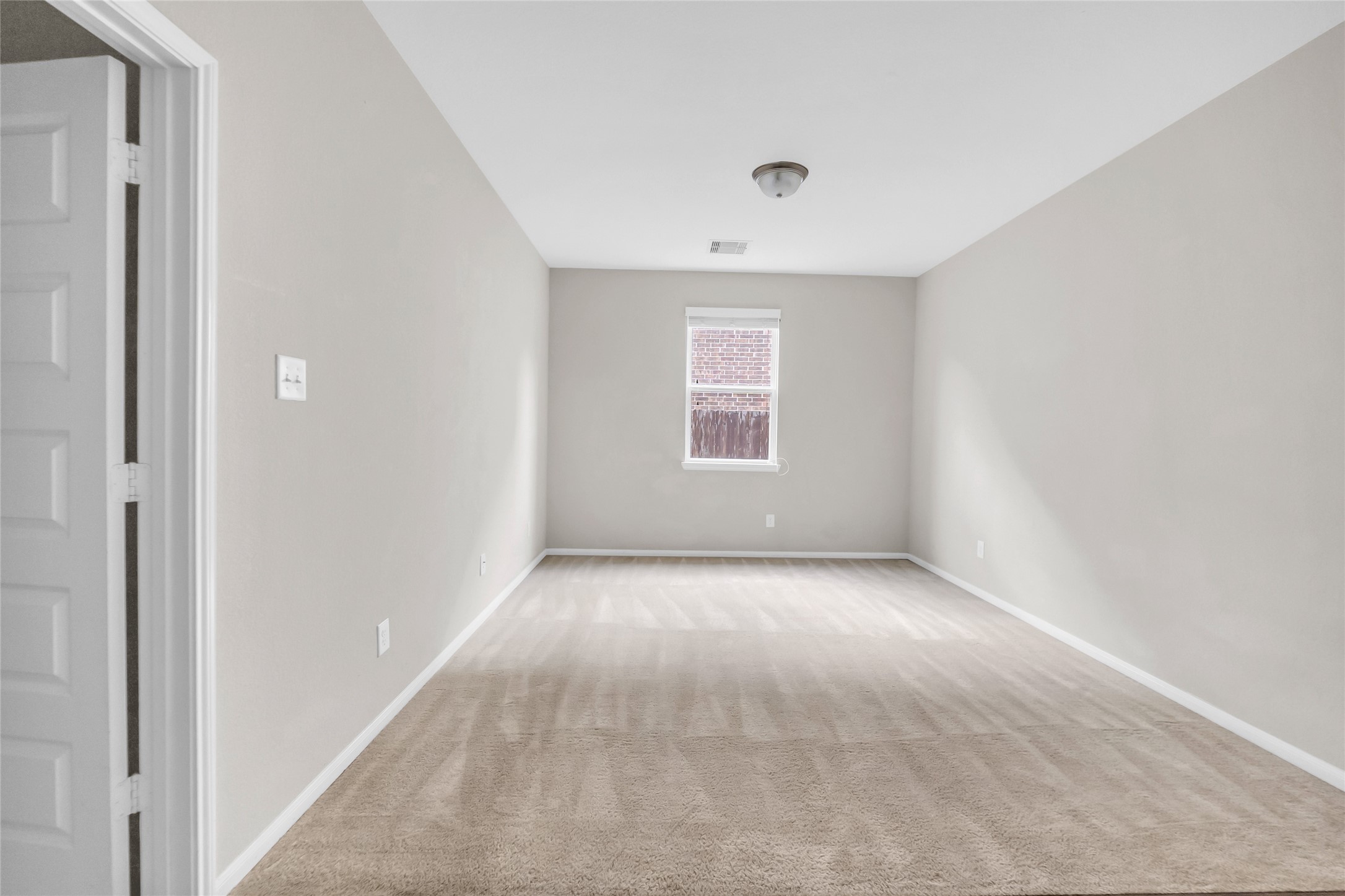 22519 Birch Ridge Meadow Drive Spring, TX 77389 - Photo 14 of 17 an empty room with a empty space and windows