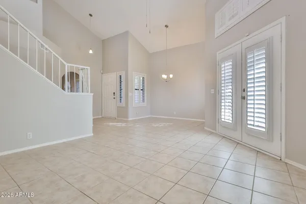 a view of an empty room with glass door