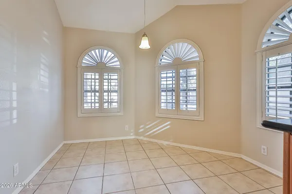a view of an empty room with windows