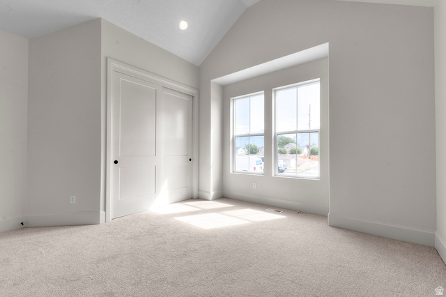 11718 South Halls Crk Road Draper, UT 84020 - Photo 8 of 28 Unfurnished bedroom with carpet flooring, vaulted ceiling, a closet, and recessed lighting