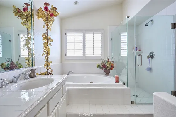 a view of walk in closet with clothes