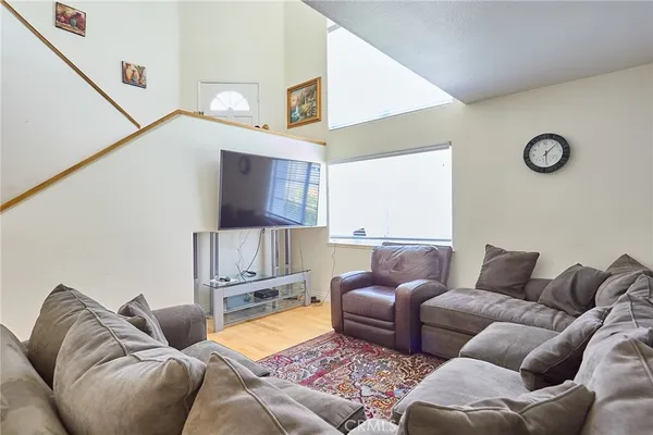 a living room with a couch and a flat screen tv