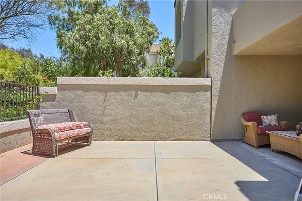 a view of a backyard with sitting area