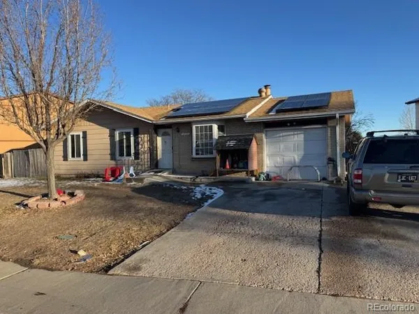 a front view of a house with garage