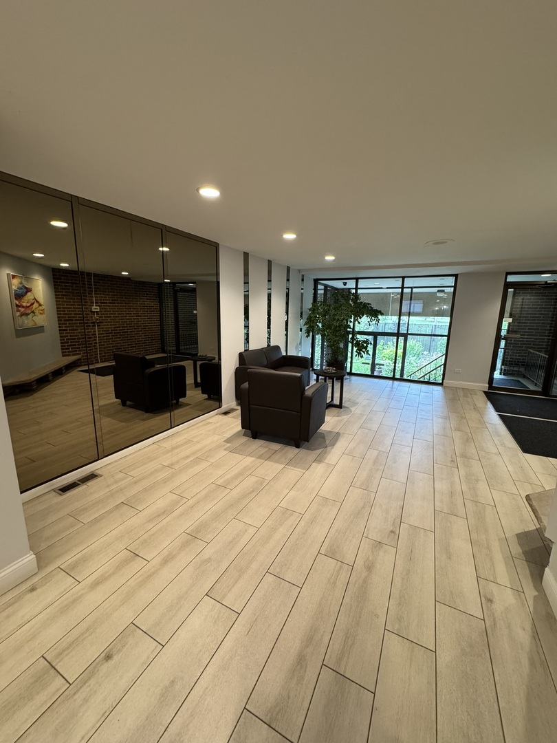 9244 Gross Point Road, Unit 103 Skokie, IL 60077 - Photo 2 of 28 a view of a kitchen with a sink