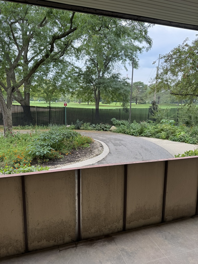 9244 Gross Point Road, Unit 103 Skokie, IL 60077 - Photo 23 of 28 a view of backyard with green space