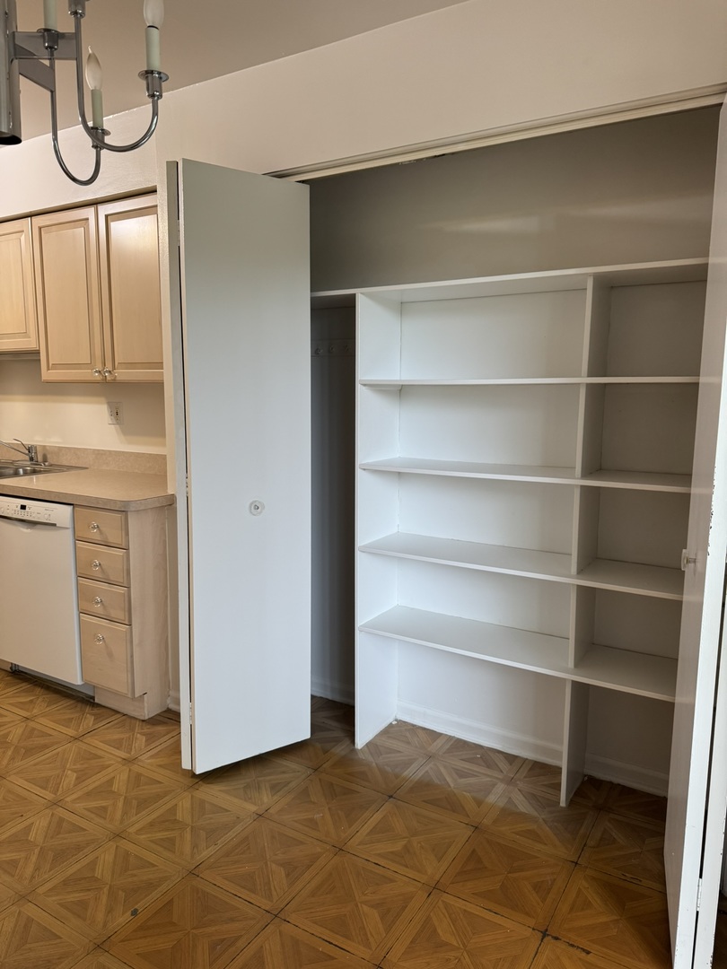 9244 Gross Point Road, Unit 103 Skokie, IL 60077 - Photo 9 of 28 a view of a room with storage and utility room