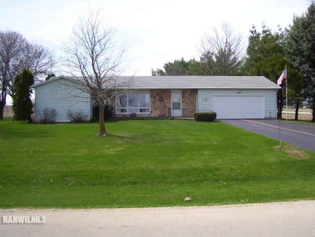 1814 North Rink Road Freeport, IL 61032 - Photo 1 of 14 a backyard of a house with lots of green space