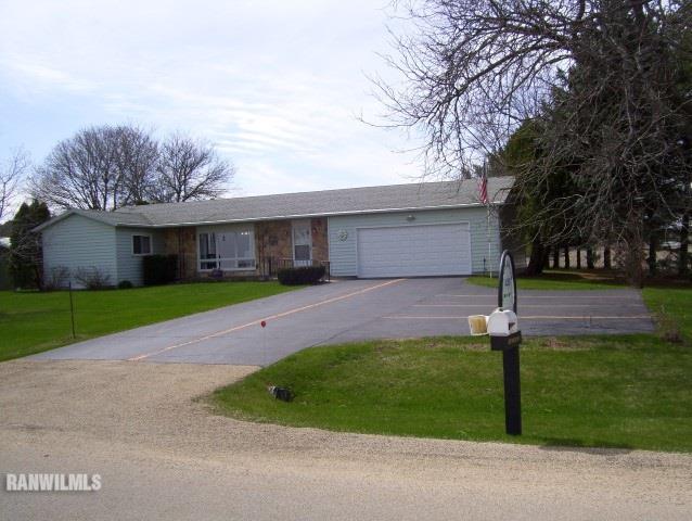 1814 North Rink Road Freeport, IL 61032 - Photo 12 of 14 a view of a house with a yard plants and large tree