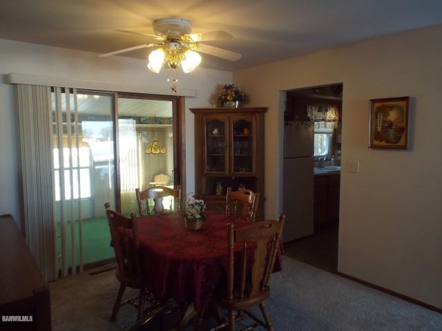 1814 North Rink Road Freeport, IL 61032 - Photo 3 of 14 a view of a dining room with furniture and chandelier