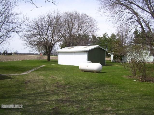 1814 North Rink Road Freeport, IL 61032 - Photo 9 of 14 a view of a white house with a yard