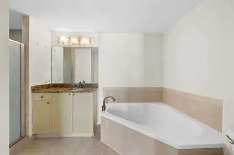 a bathroom with a bathtub and shower