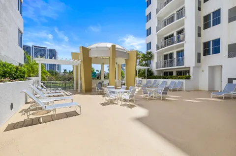 a view of a building with sitting area