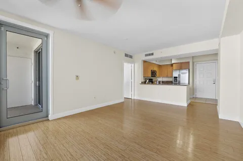 a view of a kitchen with a sink and cabinets