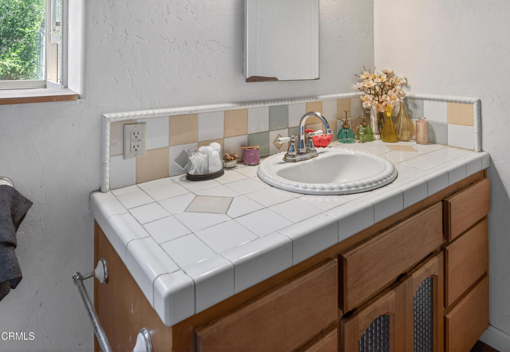 8416 Wheeler Canyon Road Santa Paula, CA 93060 - Photo 22 of 48 a bathroom with a sink and a mirror