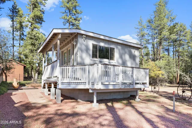 a house with trees in the background