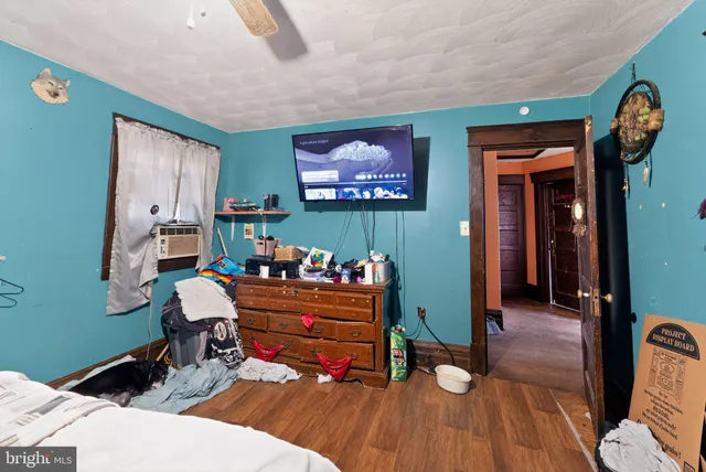 a reading room with furniture and wooden floor