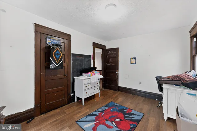 a bedroom with a bed and furniture