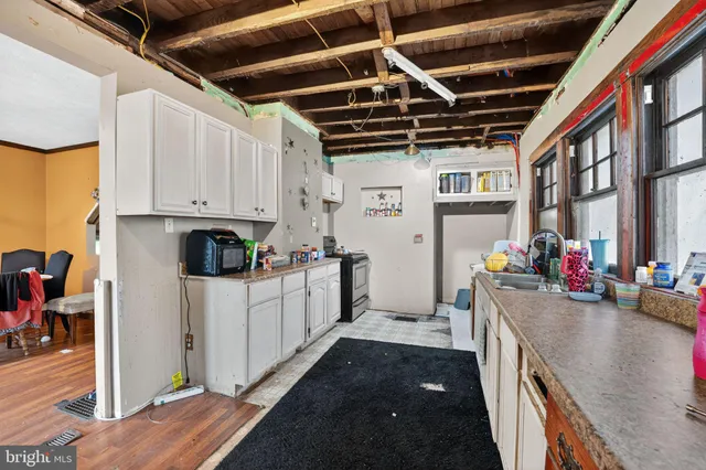 a kitchen with sink cabinets and window