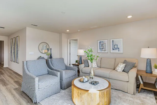 a living room with furniture and a table