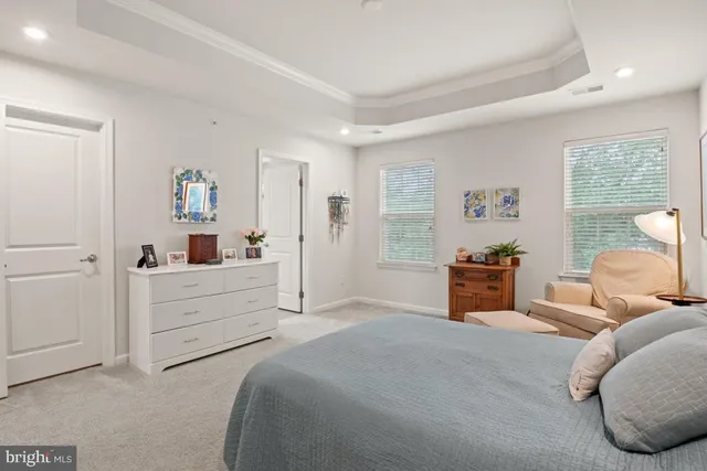 a bed room with furniture and a window