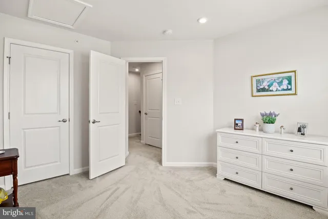 a view of room with cabinet and mirror