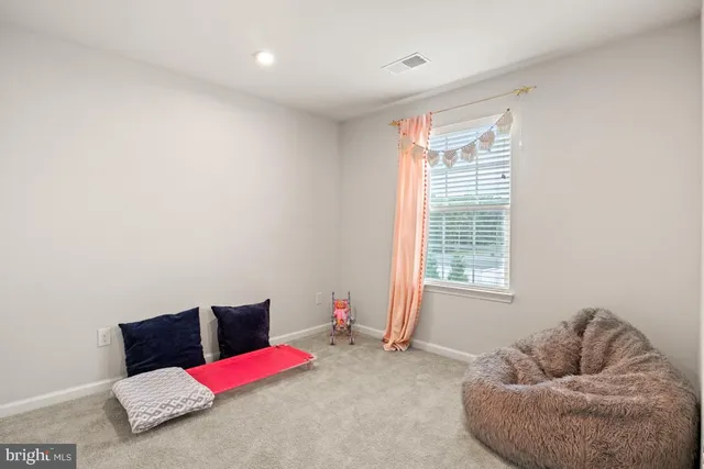 a bedroom with furniture and a couch