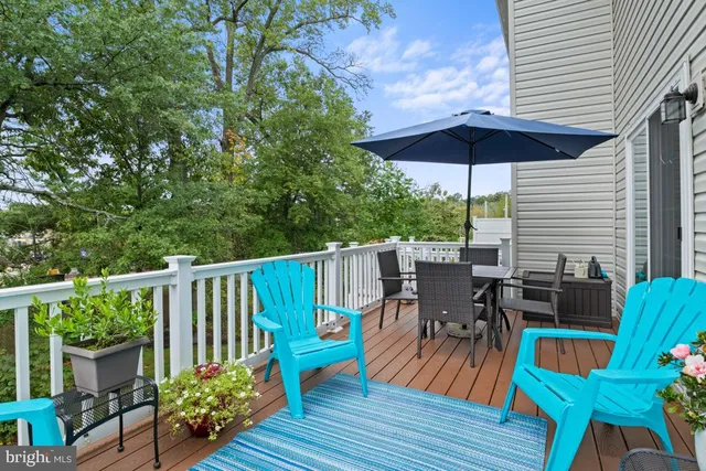 a view of deck with furniture and barbeque oven