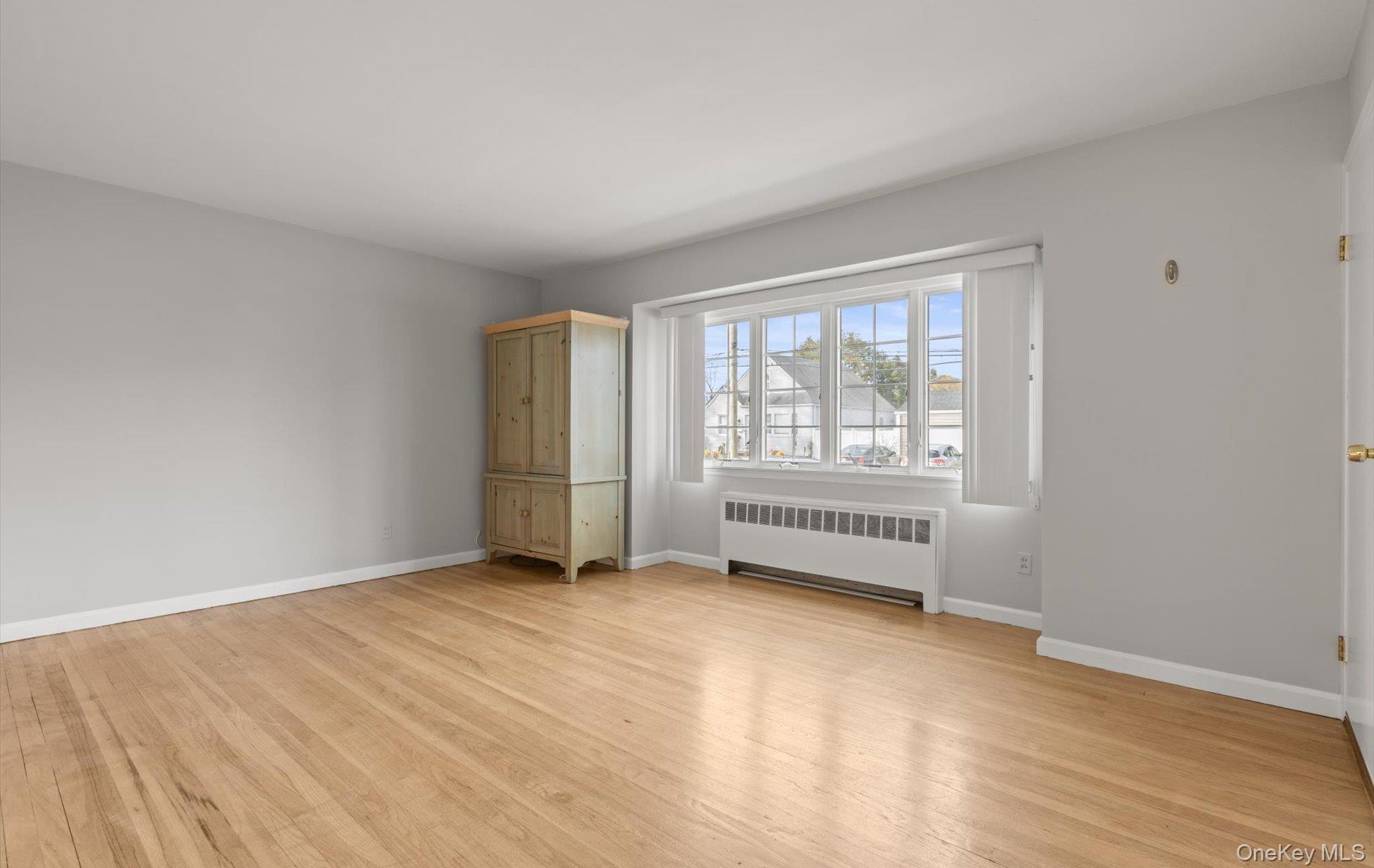 124 Kilburn Road South Garden City South, NY 11552 - Photo 9 of 30 an empty room with windows