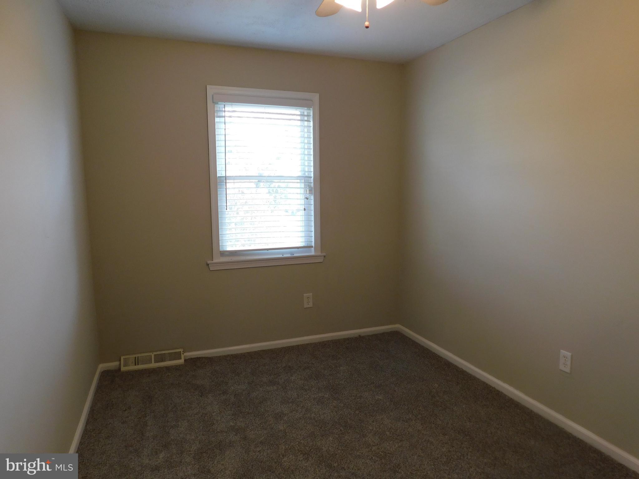 221 East Fairfax Street Berryville, VA 22611 - Photo 12 of 15 an empty room with a window