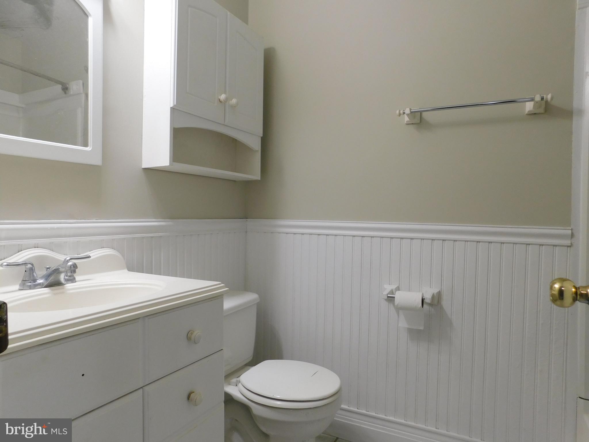 221 East Fairfax Street Berryville, VA 22611 - Photo 13 of 15 a bathroom with a sink a toilet and mirror