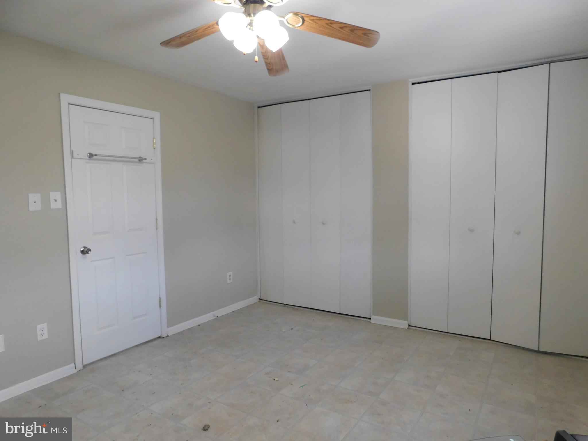 221 East Fairfax Street Berryville, VA 22611 - Photo 15 of 15 an empty room with a ceiling fan