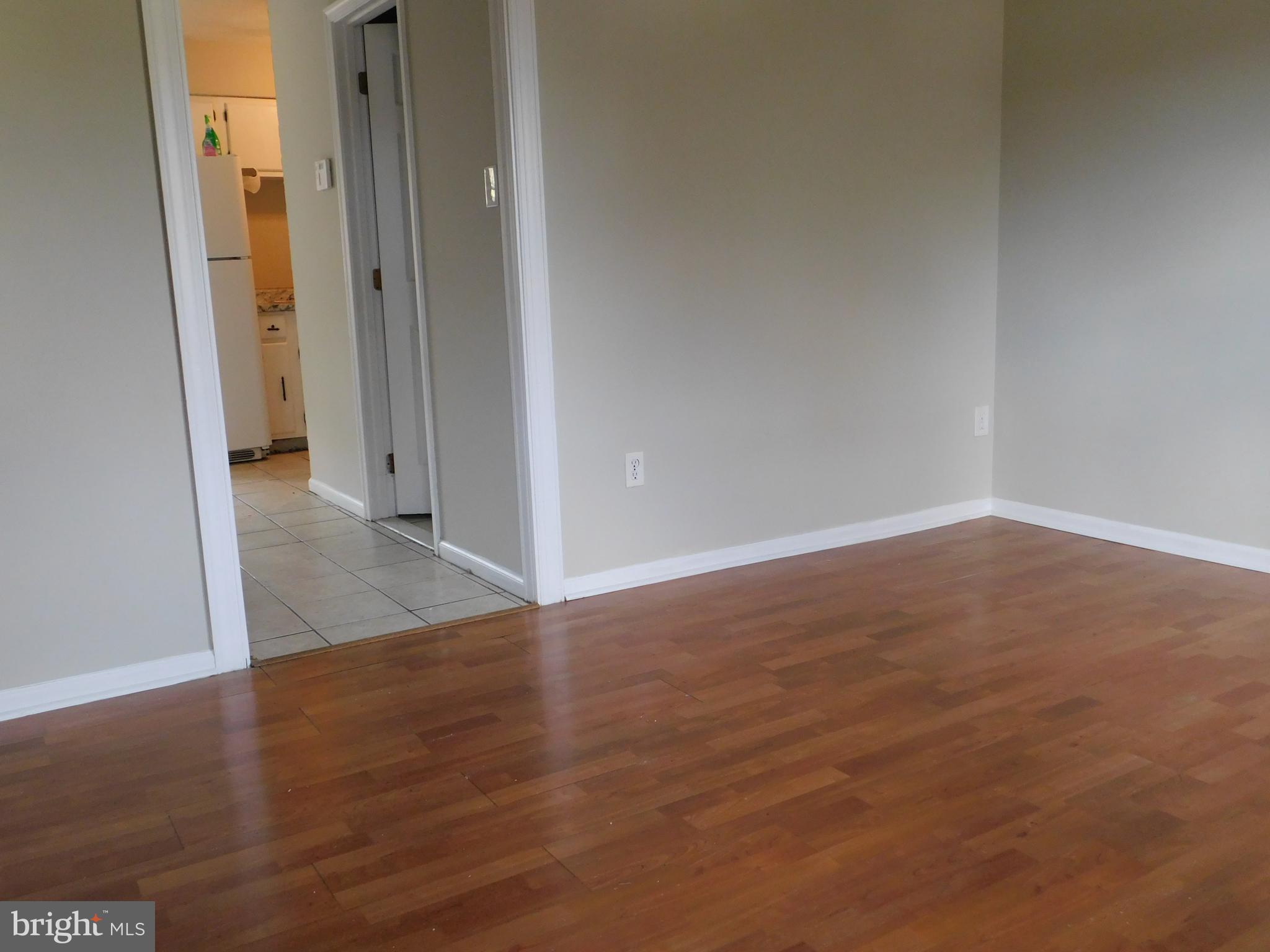 221 East Fairfax Street Berryville, VA 22611 - Photo 3 of 15 an empty room with wooden floor