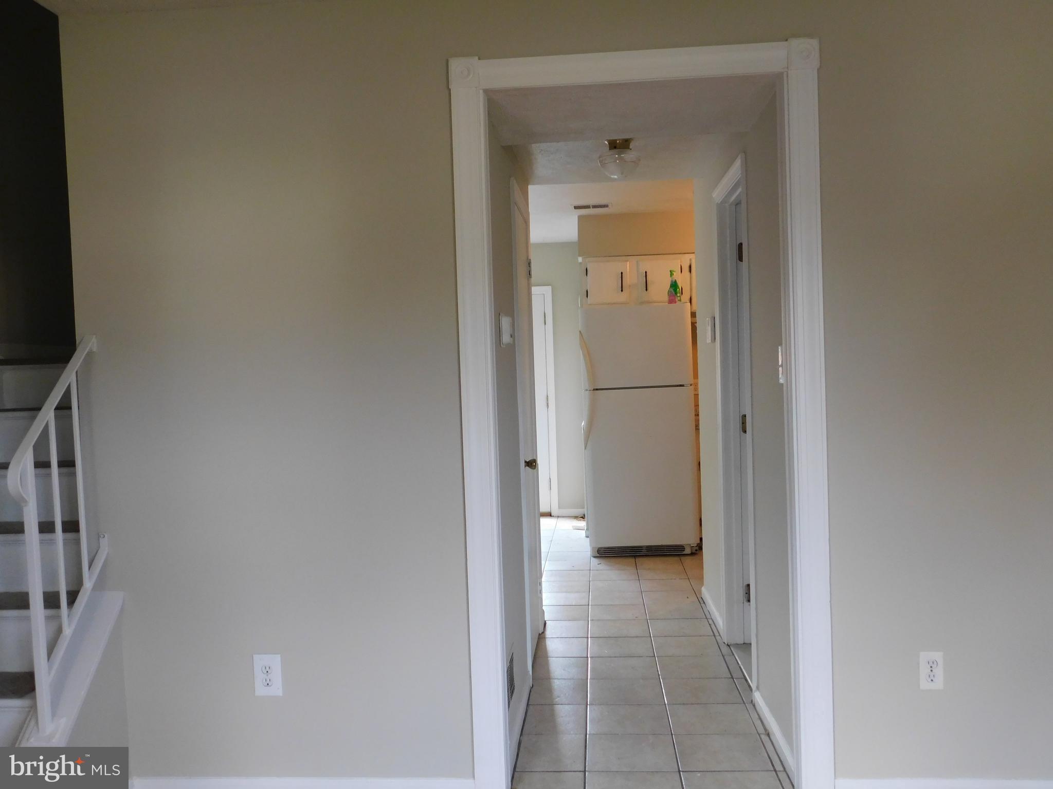 221 East Fairfax Street Berryville, VA 22611 - Photo 6 of 15 a view of a hallway with a glass door and a bathroom