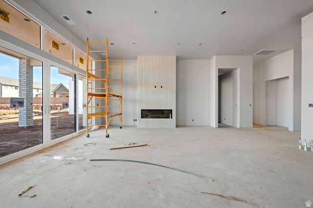 4961 Ripple Road Washington, UT 84780 - Photo 4 of 11 Unfurnished living room with a large fireplace