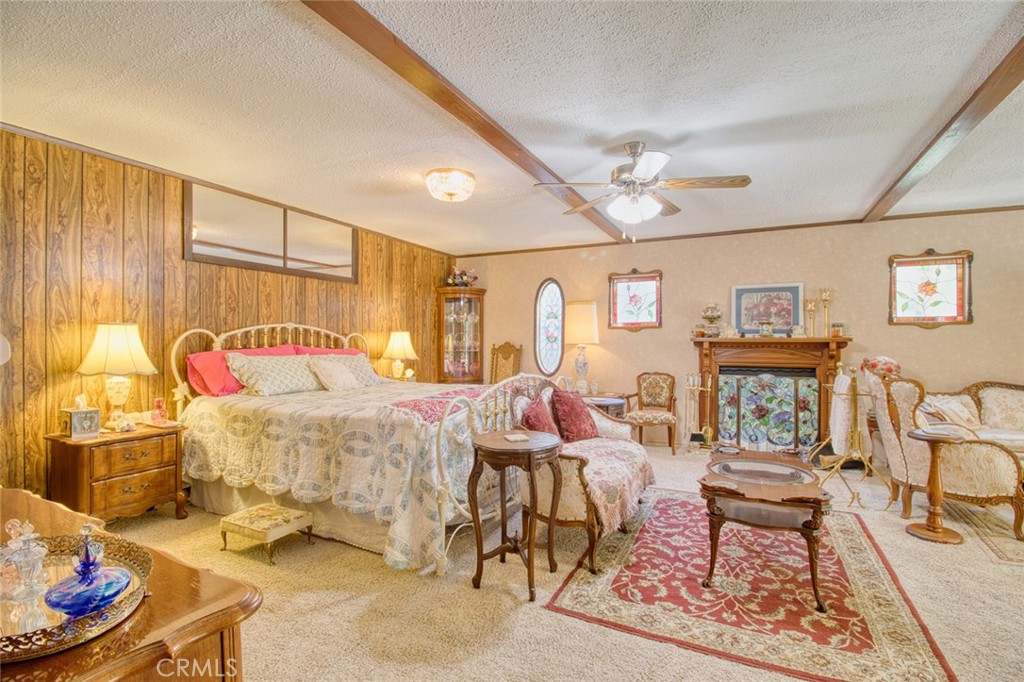 1513 Twin Lakes Road Wrightwood, CA 92397 - Photo 17 of 60 a bedroom with a bed and wooden floor