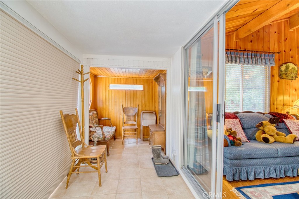 1513 Twin Lakes Road Wrightwood, CA 92397 - Photo 30 of 60 a balcony with chairs and glass door