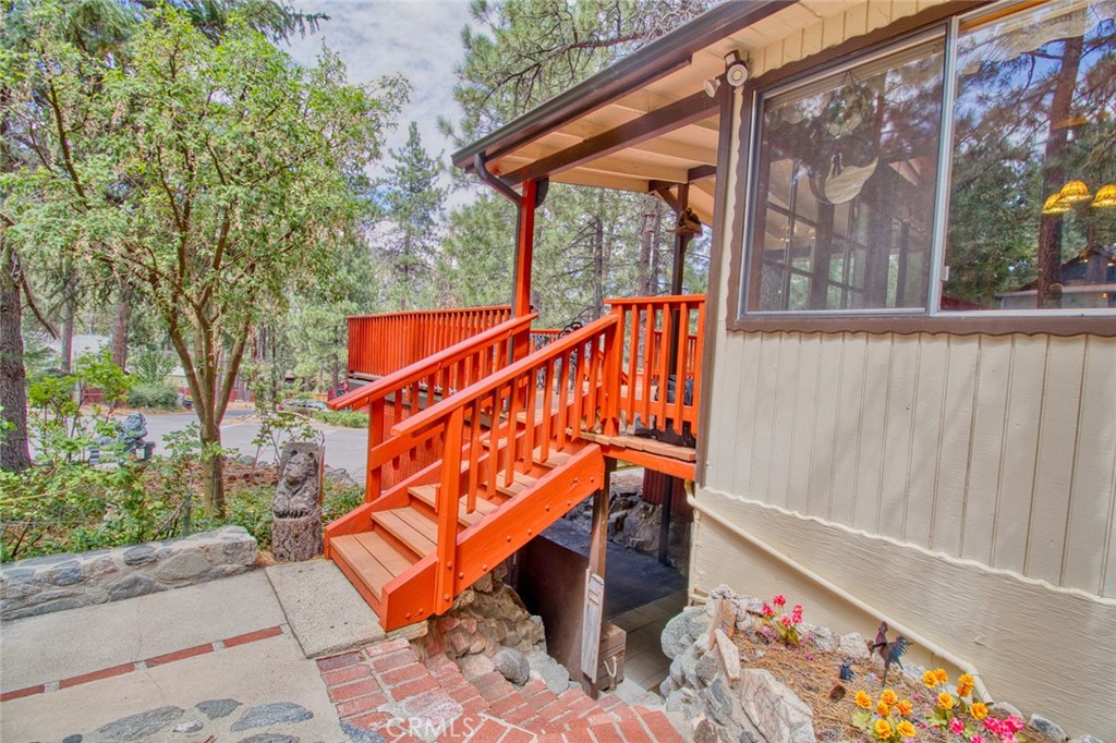 1513 Twin Lakes Road Wrightwood, CA 92397 - Photo 52 of 60 a blue bench sitting in front of a building