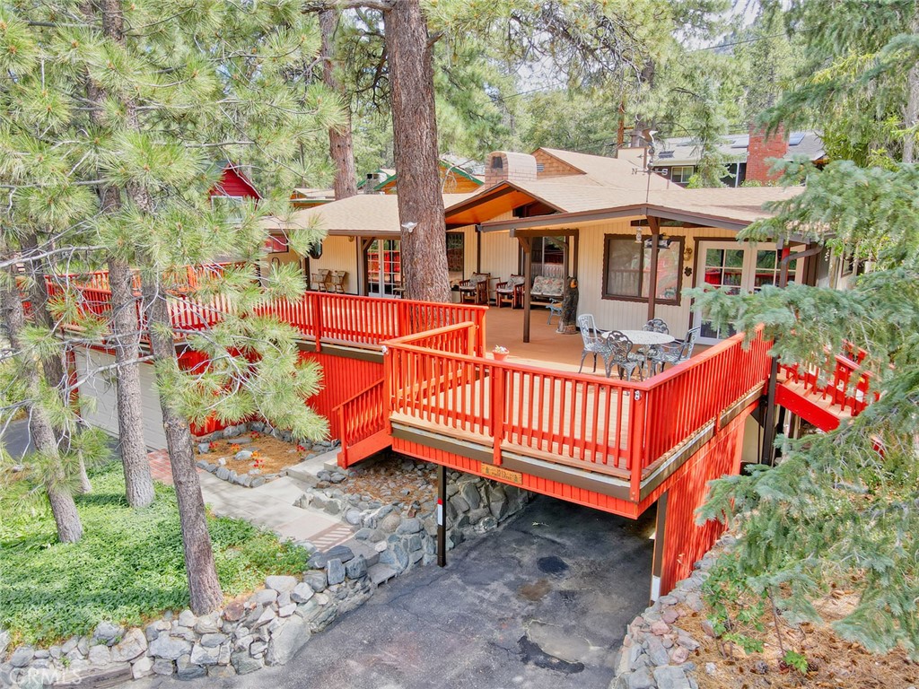 1513 Twin Lakes Road Wrightwood, CA 92397 - Photo 55 of 60 a front view of a house with porch and garden