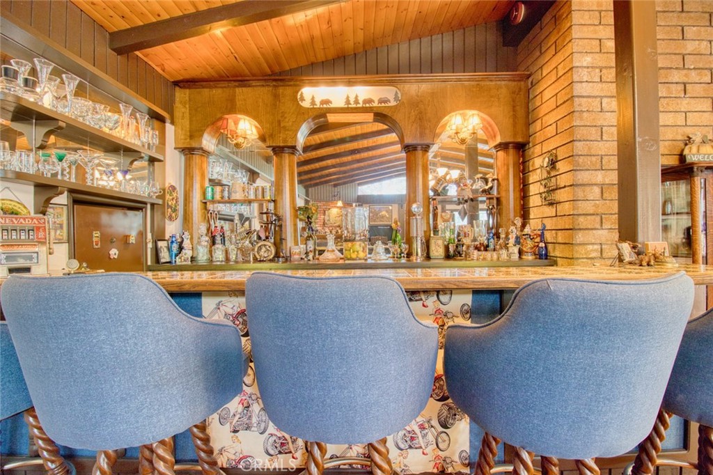 1513 Twin Lakes Road Wrightwood, CA 92397 - Photo 6 of 60 a balcony with table and chairs