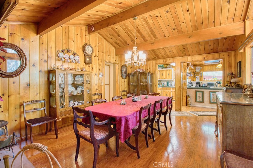 1513 Twin Lakes Road Wrightwood, CA 92397 - Photo 9 of 60 a dining room with furniture and wooden floor