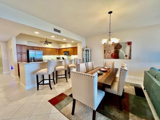 3333 Sunset Key Circle, Unit 303 Punta Gorda, FL 33955 - Photo 14 of 63 a living room with furniture and a chandelier