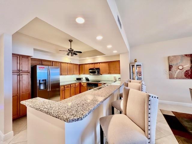 3333 Sunset Key Circle, Unit 303 Punta Gorda, FL 33955 - Photo 15 of 62 a living room with stainless steel appliances kitchen island granite countertop furniture and a kitchen view