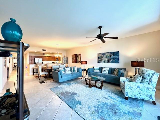 3333 Sunset Key Circle, Unit 303 Punta Gorda, FL 33955 - Photo 17 of 63 a living room with furniture and a chandelier